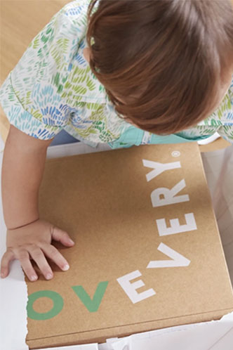 Toddler playing with Lovevery box